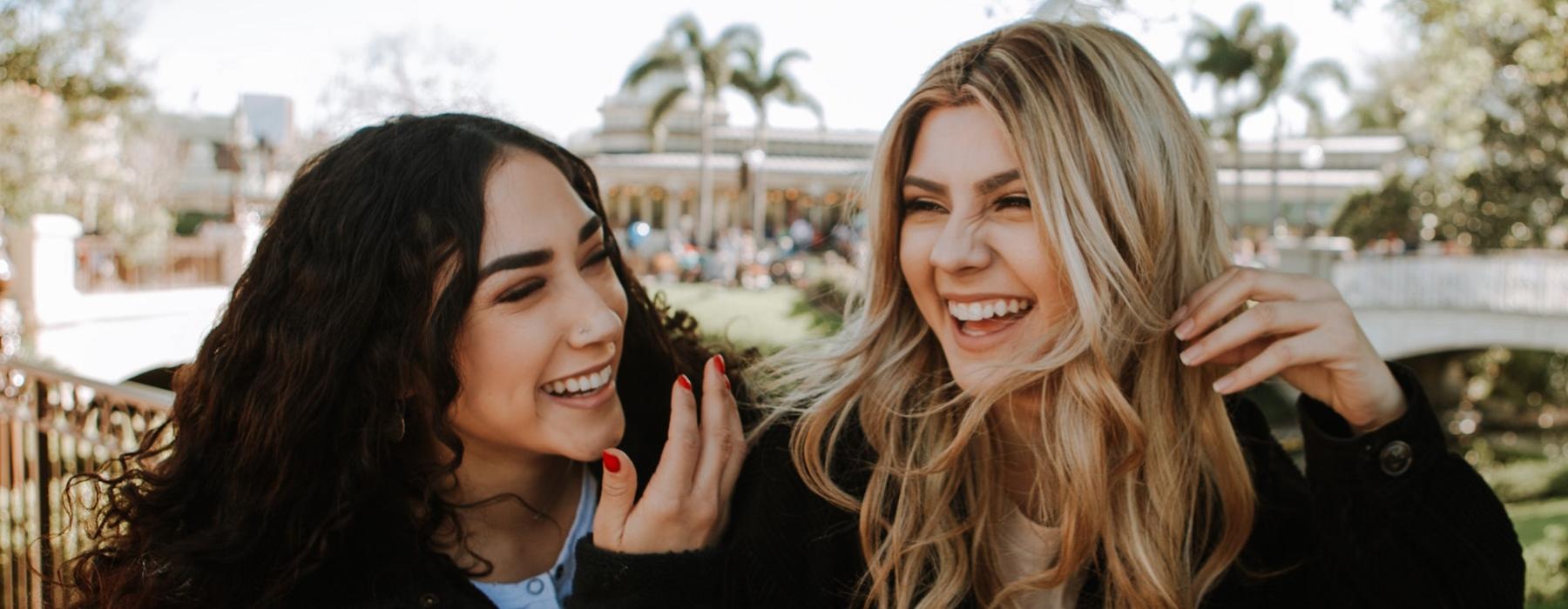 a couple of women smiling