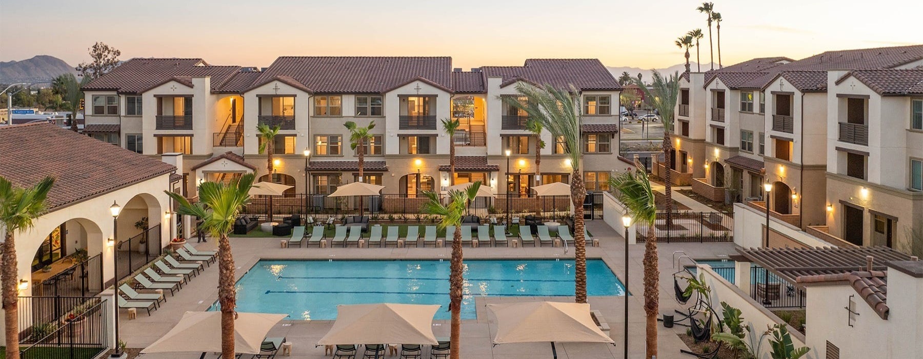 pool showing reclining seating and nearness to property buildings